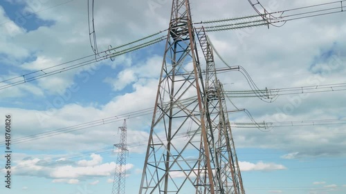 Survey of high-voltage power lines by a quadrocopter. High Voltage Electricity Transmission Pylon. Power Lines Supply With Wire. Electricity Transportation Industry Energetics.