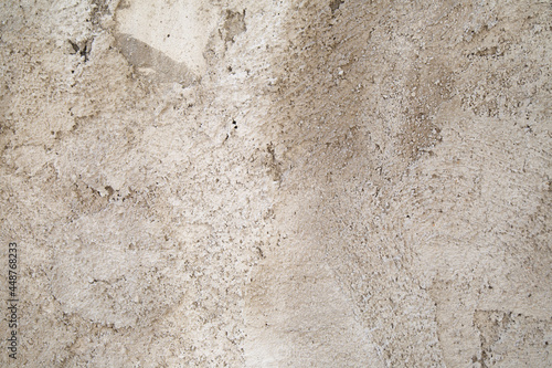 Textured beige plastered surface  close-up.