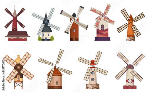 Collection of traditional ancient windmill buildings. Rural organic agricultural production, ecological food manufacturing, clean energy concept, wind mill farm. Medieval european windmill