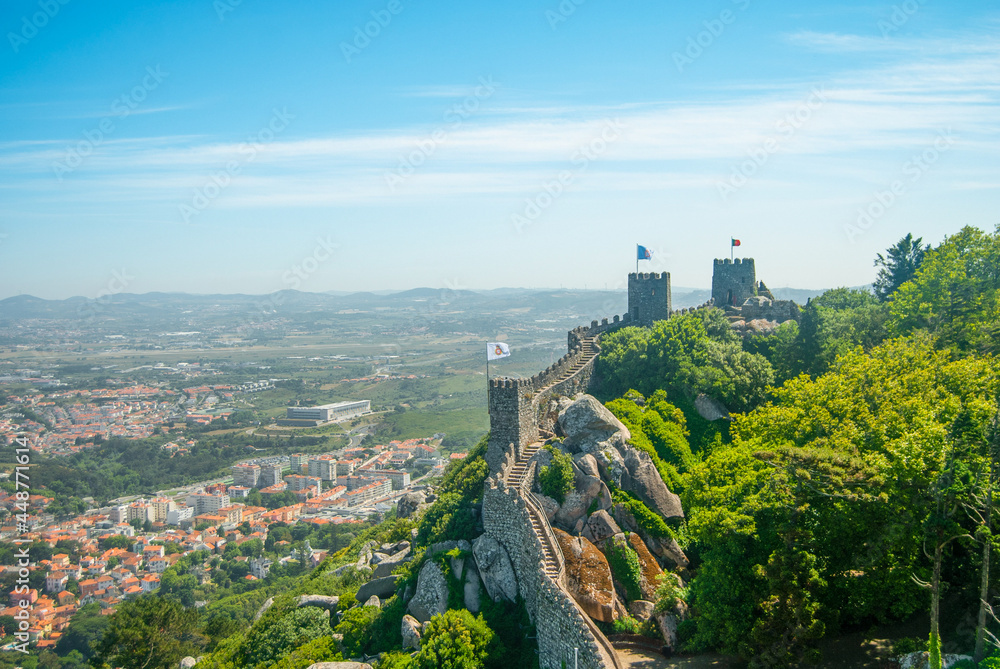 Landscape of an old fortress wall and the city at the bottom of the hill - Moorish Castle, Sintra, Portugal - Space for text, 28.05.2021 Landscape of an old fortress wall and the city at the bottom of the hill - Moorish Castle, Sintra, Portugal - Space for text, 28.05.2021