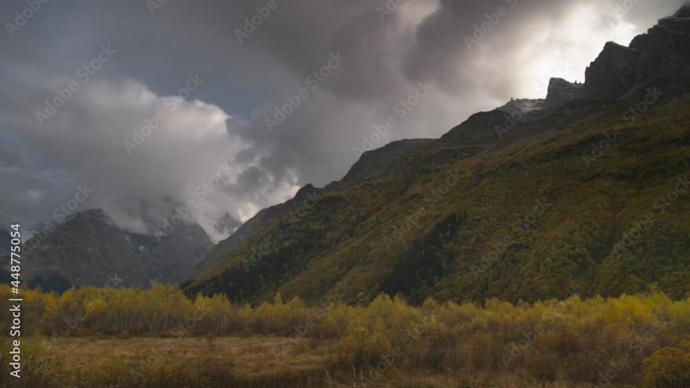 High dynamic range image autumn mountain valley with thunderclouds. Panorama life handheld live camera High dynamic range image autumn mountain valley with thunderclouds. Panorama life handheld live camera