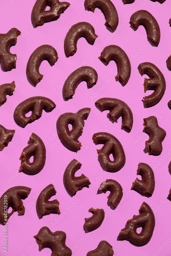 Obraz premium Chocolate cookies half on pink background. Sweets cacao lover concept. Minimal art. Holidays party time, winter christmas celebration season wallpaper