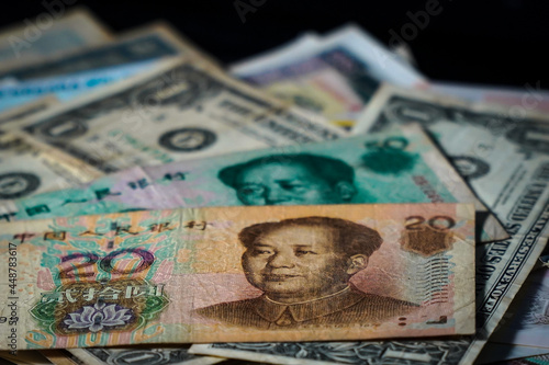 Chinese banknote money currency with stock market graph background