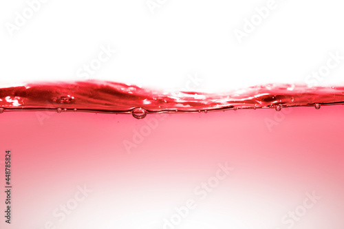 Red clean water with water drops and waves.