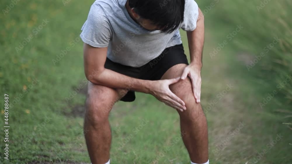 Athlete Asian man Knee pain after exercise, Injury from workout concept Athlete Asian man Knee pain after exercise, Injury from workout concept