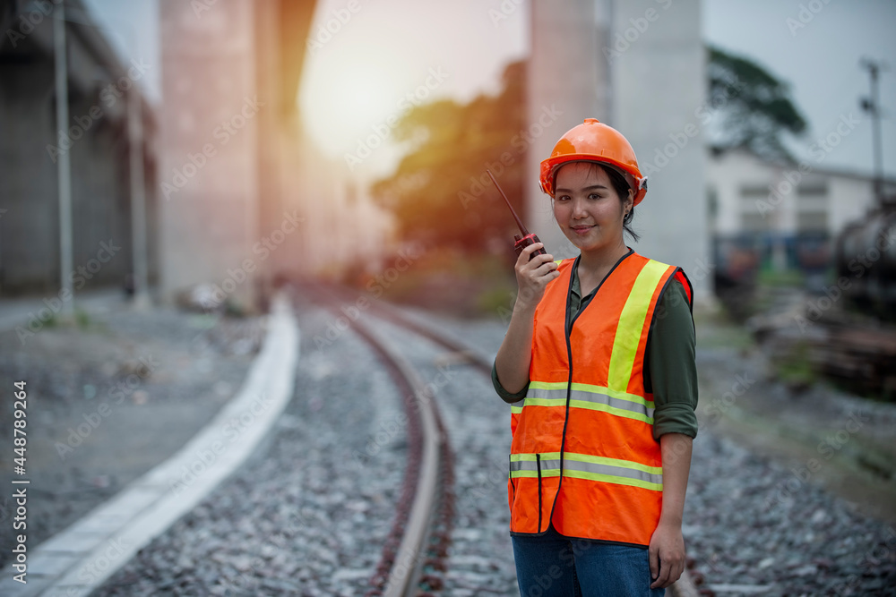 Obraz premium worker on the railroad. Engineer on railways. engineer train on the railway. Worker walk on railway. engineer railway concept.