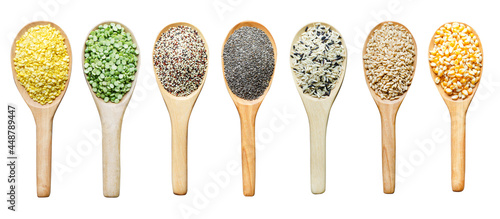 Group of dry organic cereal and grain seed pile in wooden spoon consisted of mung bean, quinoa, chia seed, rice, barley, and corn, isolated on white background