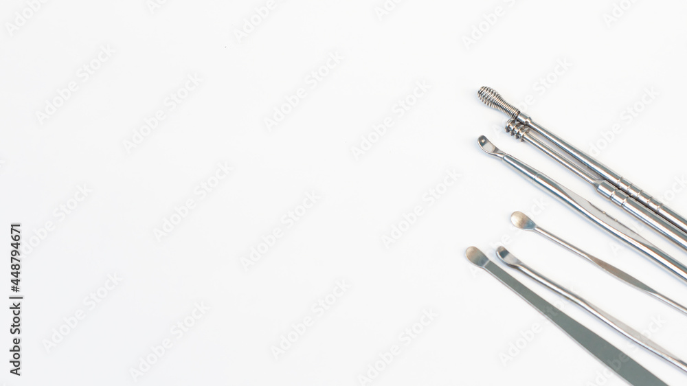 close up steel ear cleaner tools with white background close up steel ear cleaner tools with white background