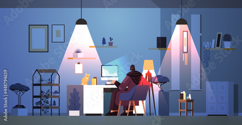 overworked arab businesswoman freelancer looking at computer screen woman analyzing financial charts