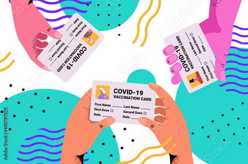 hands holding vaccination record card immunity passports risk free covid-19 pandemic pcr certificates coronavirus