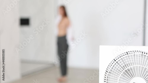 Attractive white woman undressing in her room, selective focus. photo