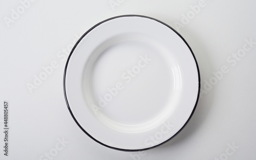 White plate with black rim