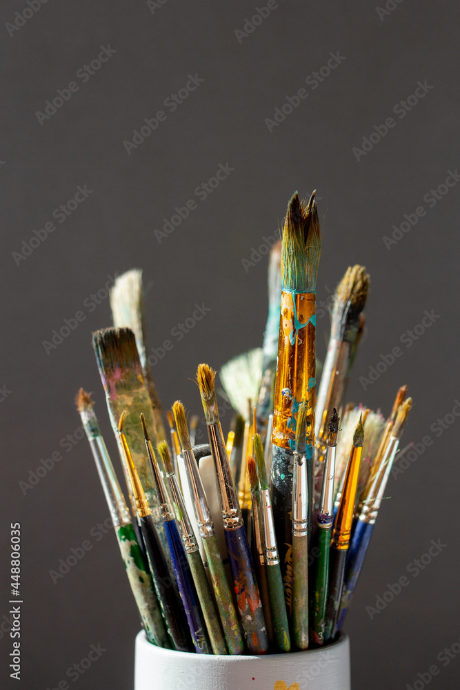 Dirty Paint brushes closeup on gray background Dirty Paint brushes closeup on gray background