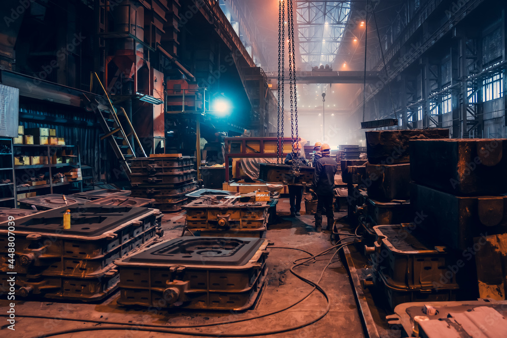 Metallurgical plant. Industrial steel production. Interior of metallurgical workshop inside with workers. Steel mill factory. Heavy industry foundry. Metallurgical plant. Industrial steel production. Interior of metallurgical workshop inside with workers. Steel mill factory. Heavy industry foundry.