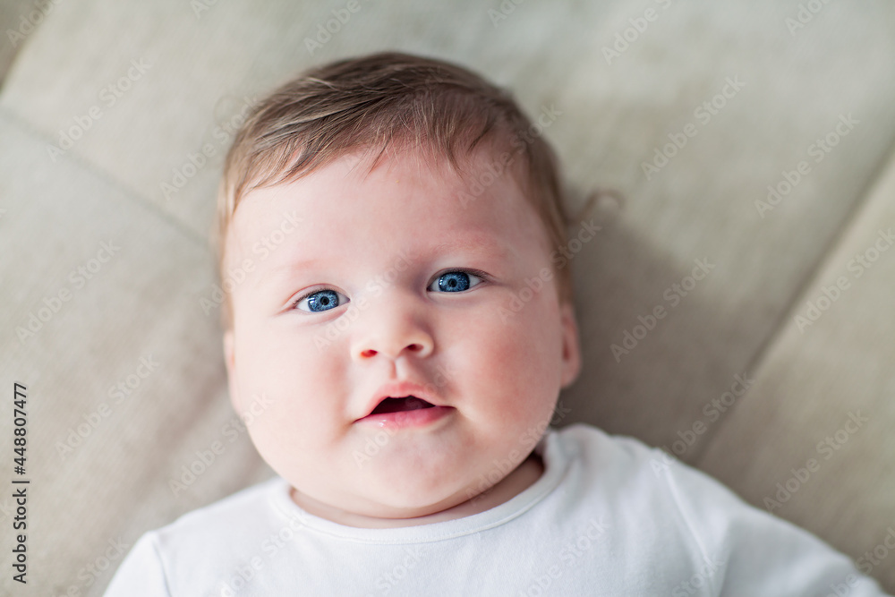 large portrait of a beautiful blue-eyed newborn