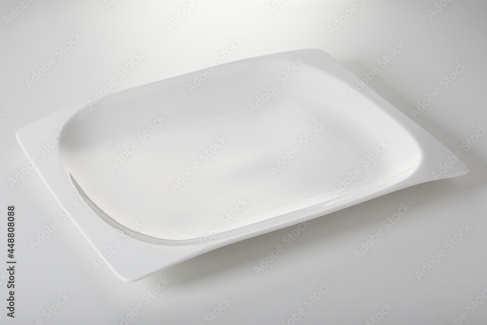 White rectangle plate on table White rectangle plate on table