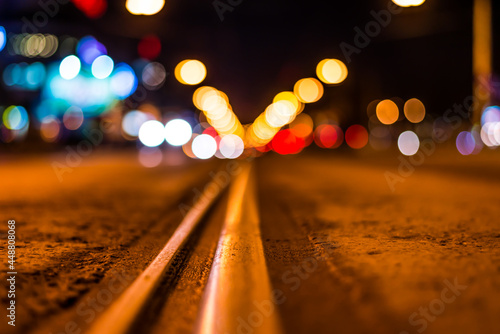 Night highway with rails, cars go over it. View from the level of asphalt © Georgii Shipin