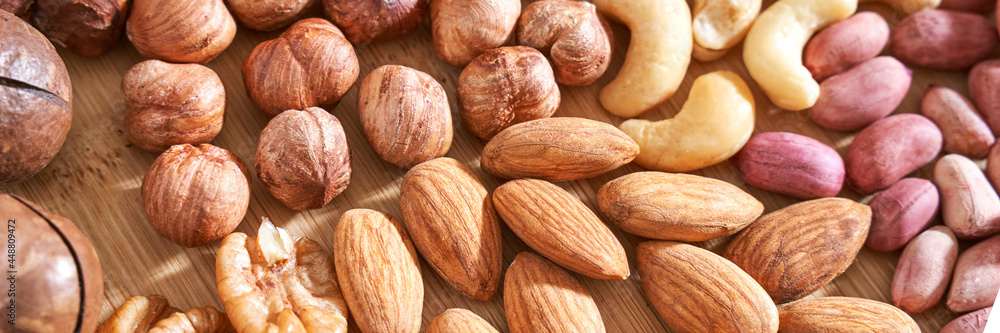 Different nuts. Home kitchen. Protein and fat food. Mix seeds. Raw whole snack. Munchies. Natural cuisine. Vegan. Peanut, almond, macadamia, pecan, cashew Different nuts. Home kitchen. Protein and fat food. Mix seeds. Raw whole snack. Munchies. Natural cuisine. Vegan. Peanut, almond, macadamia, pecan, cashew