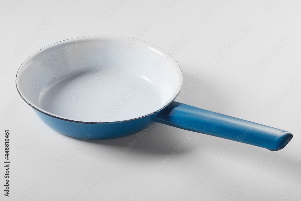 Enameled metal frying pan on white background Enameled metal frying pan on white background