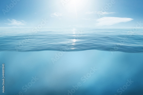 Fototapeta Blue sea or ocean water surface and underwater with sunny and cloudy sky