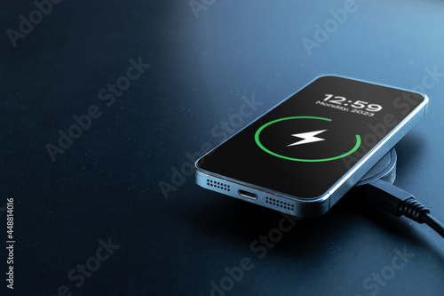 Phone charge. Mobile cell phone charge battery from wireless smart charger. Modern technology, portable fast charger.