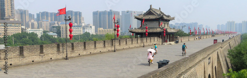 Vászonkép Xian City Wall in China with people walking on top.