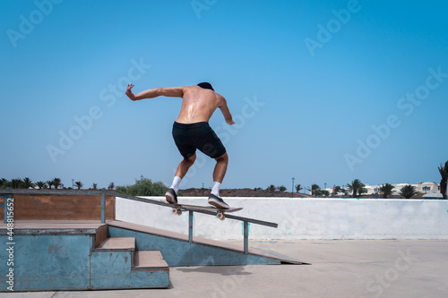 young skater man jumps with his skateboard on the stairs and falls. movement 2