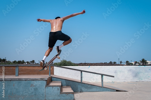 young skater man jumps with his skateboard on the stairs and falls. movement 1