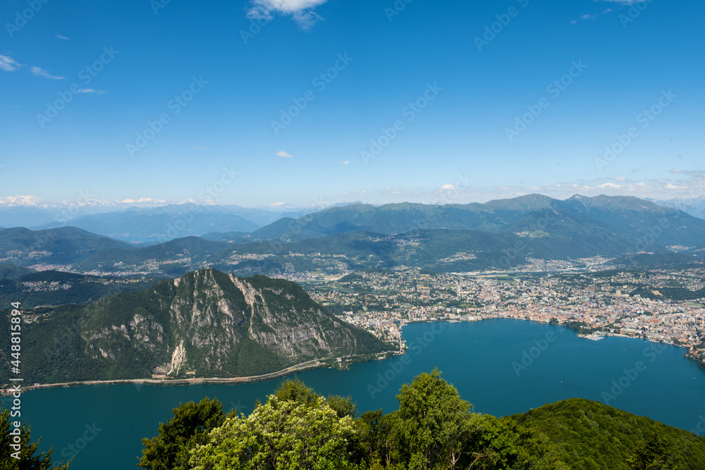Gorgeous view from the hill top at Balcony of Italy, over Lake Lugano, city Lugano and other cities. The view go far into Switzerland, all to the way to the Swiss alps. Shot from the Italian side of t