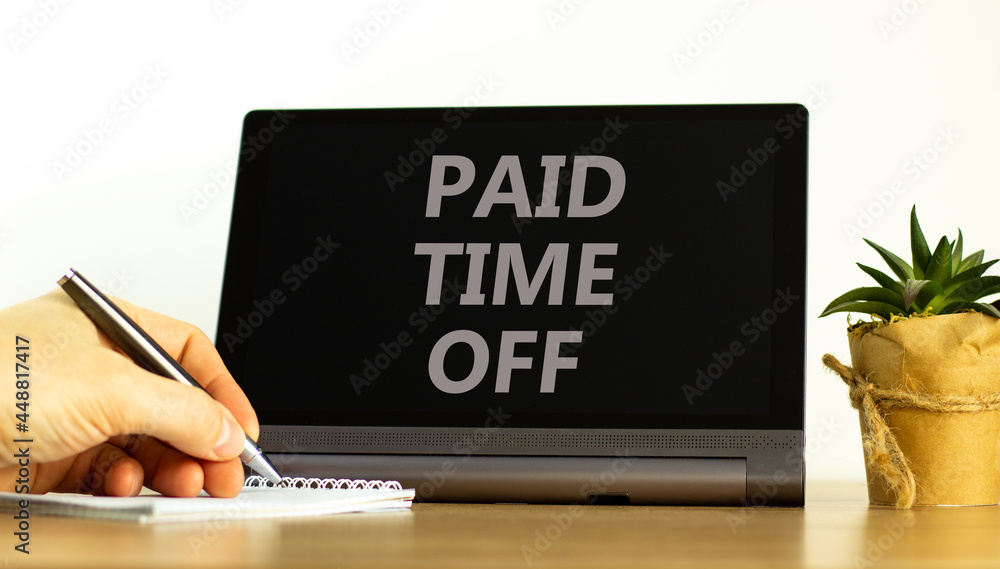 Paid time off symbol. Tablet with words 'Paid time off'. Businessman