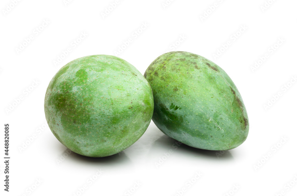 Organic fresh raw mango fruit close up on isolated white background Organic fresh raw mango fruit close up on isolated white background