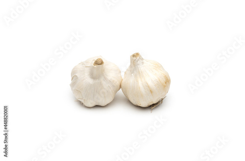 Two organic fresh spicy garlic on an isolated white background