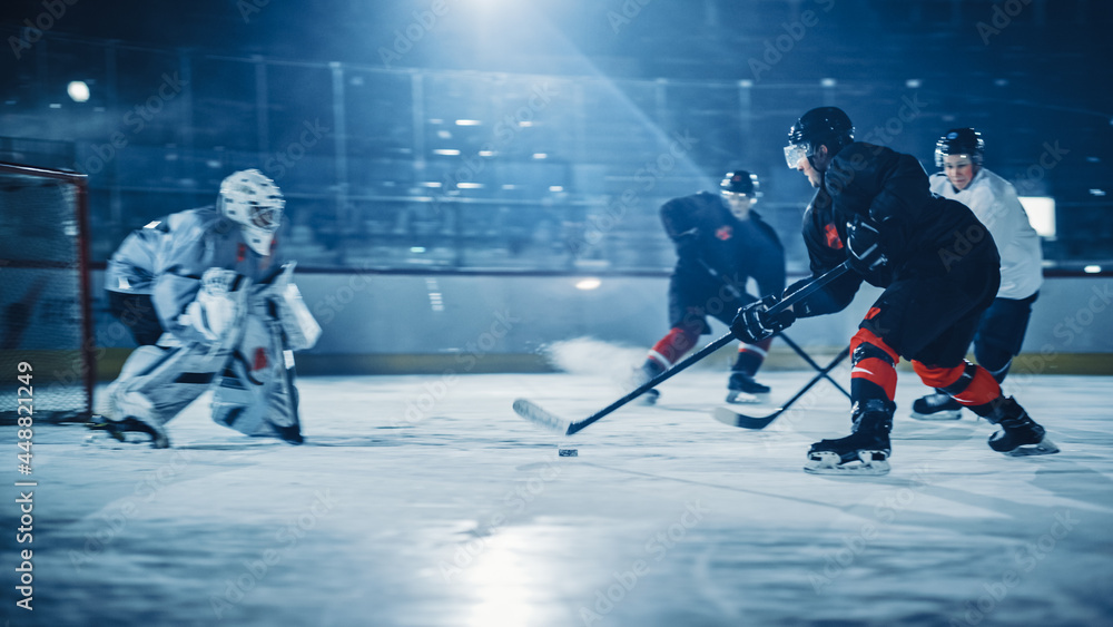 Obraz premium Ice Hockey Rink: Professional Forward Player Breaks Defense, Prepairing to Shot Puck with Stick to Score Goal. Two Competitive Teams Play Intense Game.