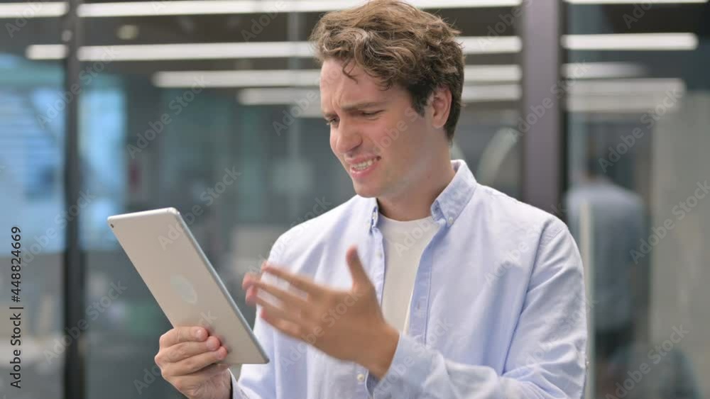 Portrait of Man having Loss on Tablet in Office Portrait of Man having Loss on Tablet in Office