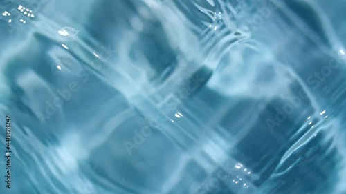 Wallpaper Mural Water surface texture top view. Water splash blue colored. Pure blue water with reflections sunlight in slow motion. Motion clean swimming pool ripples and wave. 4k. High quality 4k footage Torontodigital.ca