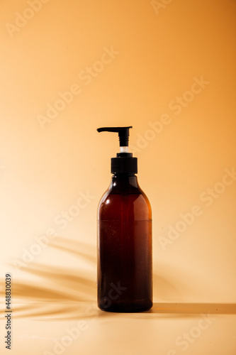 a bottle of hand cream on a beige background