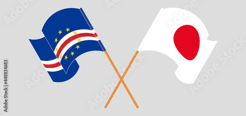 Crossed and waving flags of Cape Verde and Japan