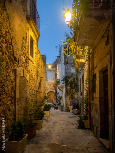 Old street of Ortigia at night photo