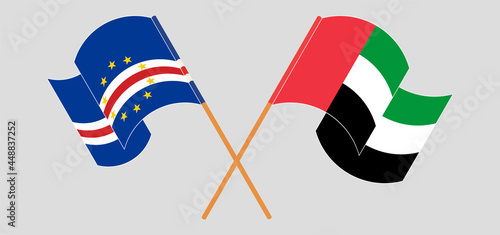 Crossed and waving flags of Cape Verde and the United Arab Emirates