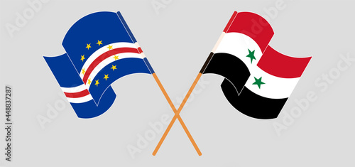 Crossed and waving flags of Cape Verde and Syria