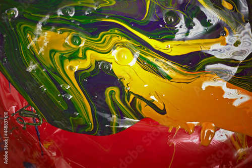 Blue, Red, and Yellow Abstract Background. Created from printing paints (polygraphic Cyan, Magenta, and Yellow). Colorful CMYK paint print concept.