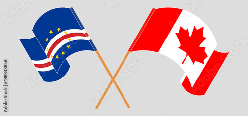 Crossed and waving flags of Cape Verde and Canada
