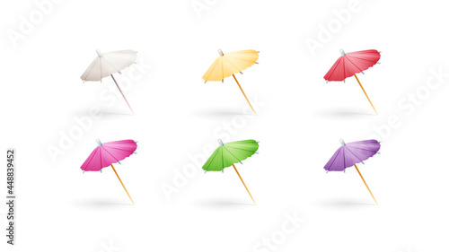 Set of multicolored paper cocktail umbrellas isolated on white background