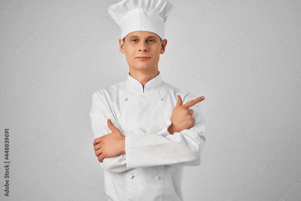 a man in a chef's uniform gesturing with his hand work professional cooking a man in a chef's uniform gesturing with his hand work professional cooking