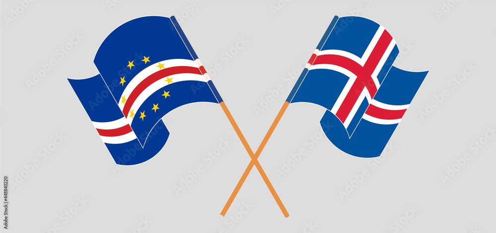 Crossed and waving flags of Iceland and Cape Verde