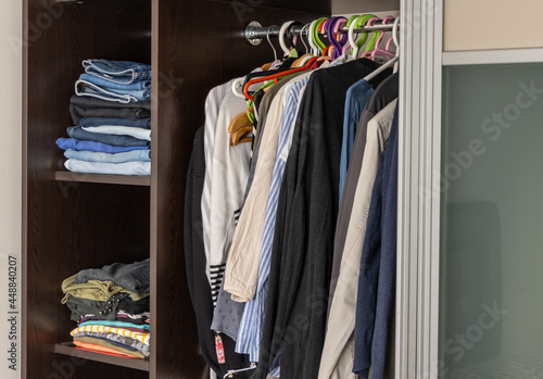 Various clothes in the wardrobe at home
