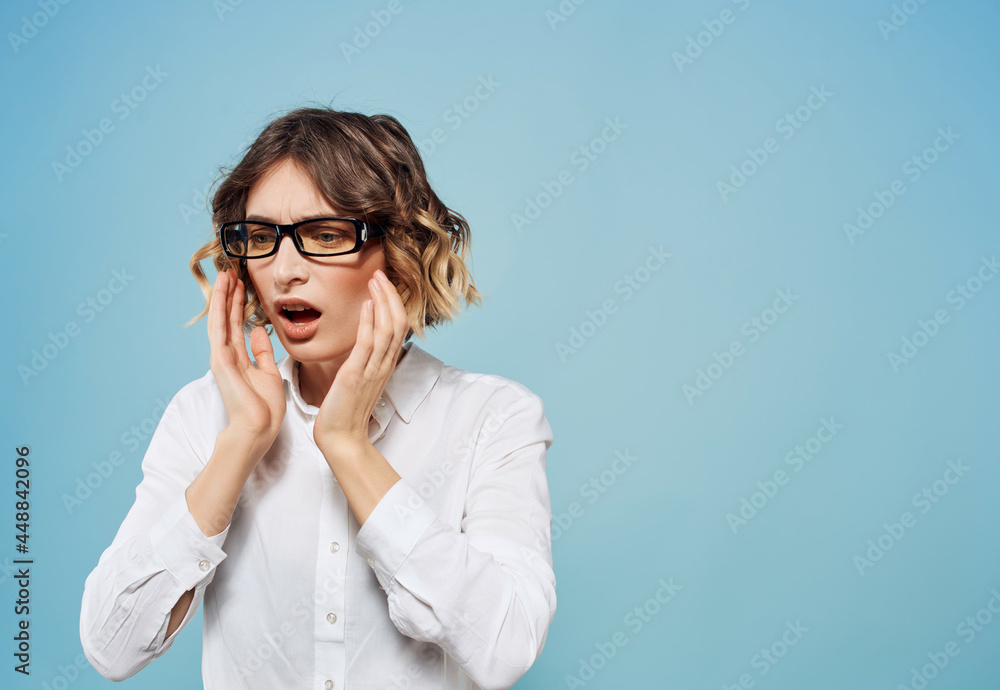 emotional business woman in white shirt gesturing with her hands studio