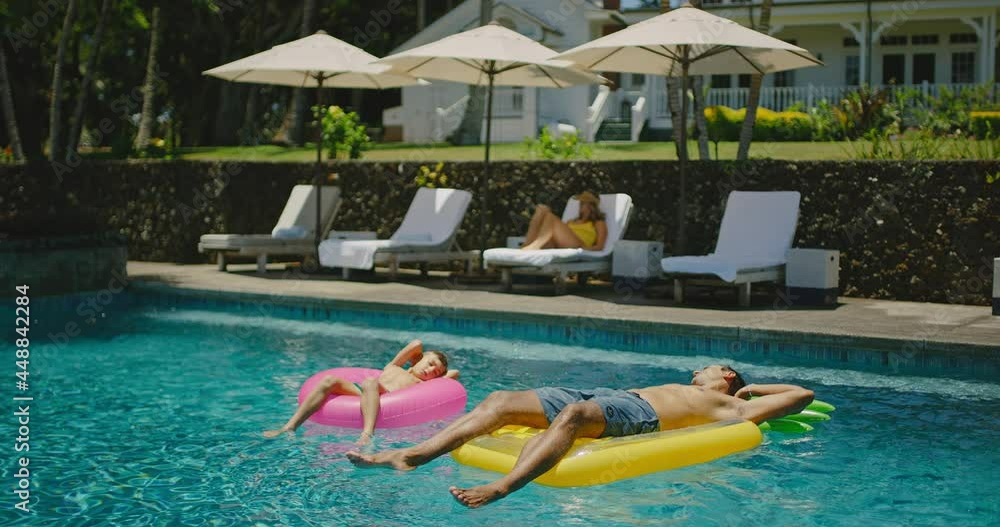 Family lifestyle at the pool, relaxing and enjoying summer vacation