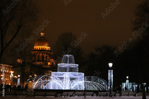 New Year's illumination on a magical Christmas night against the background of St. Isaac's Cathedral