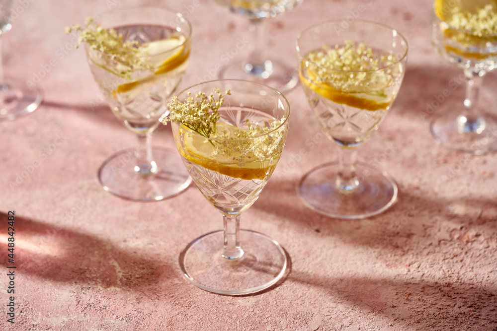 Elder flowers in a glass of lemonade. Herbal or alternative medicine. Elder flowers in a glass of lemonade. Herbal or alternative medicine.